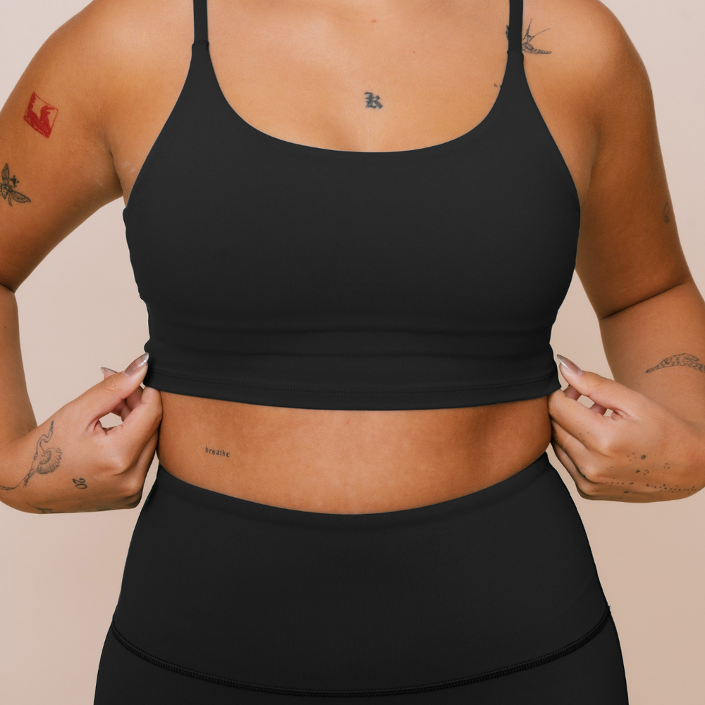 
                  
                    Supportive black tank top for yoga
                  
                