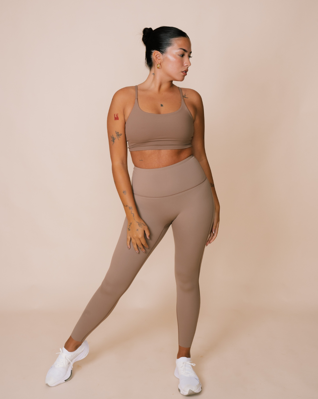 Flexibility-focused fitness attire in natural tones