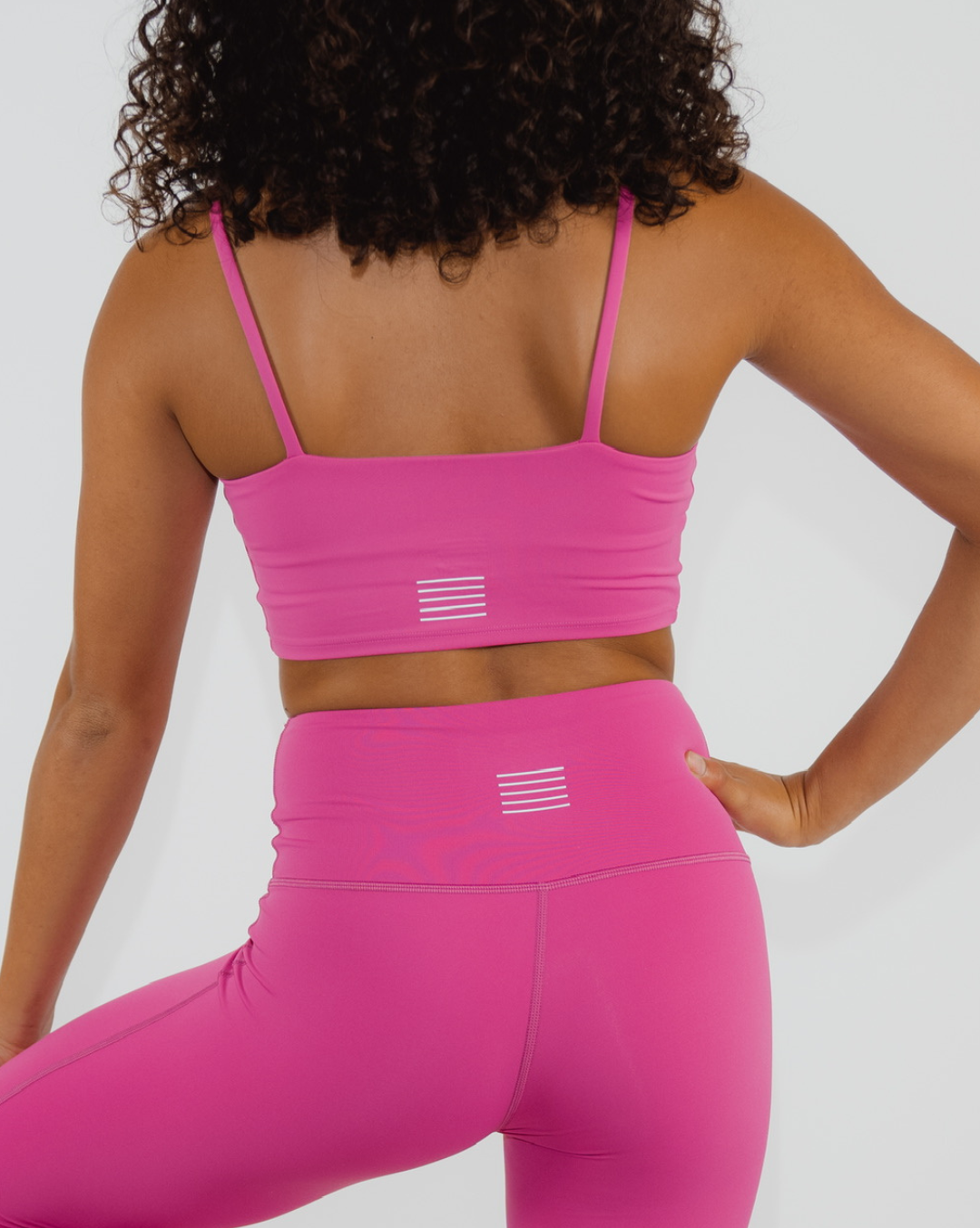 Mindful fitness practice with stylish hot pink ensemble