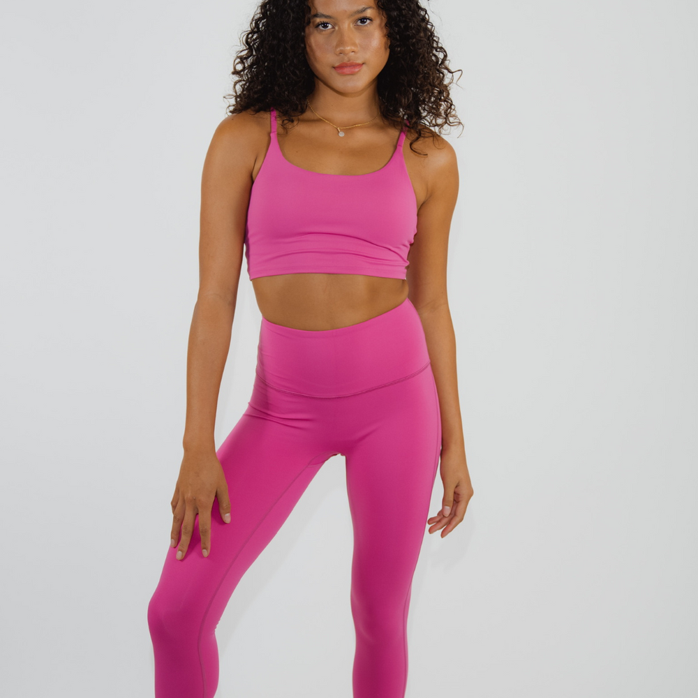 
                  
                    Flexibility-focused fitness attire in bright pink
                  
                