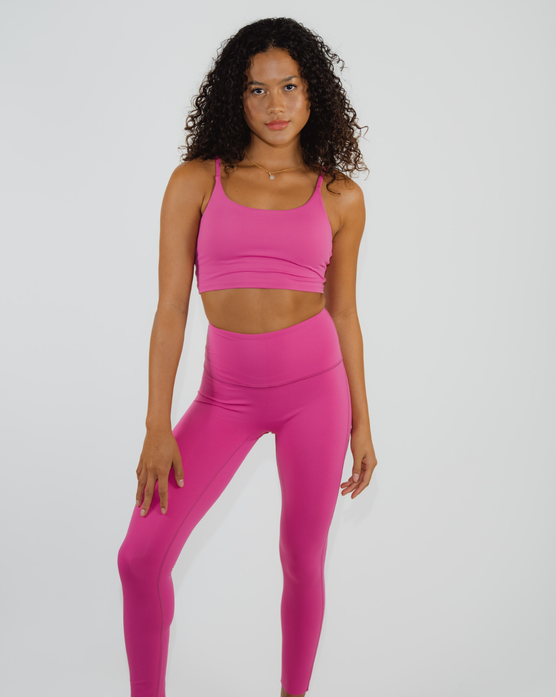 
                  
                    Flexibility-focused fitness attire in bright pink
                  
                