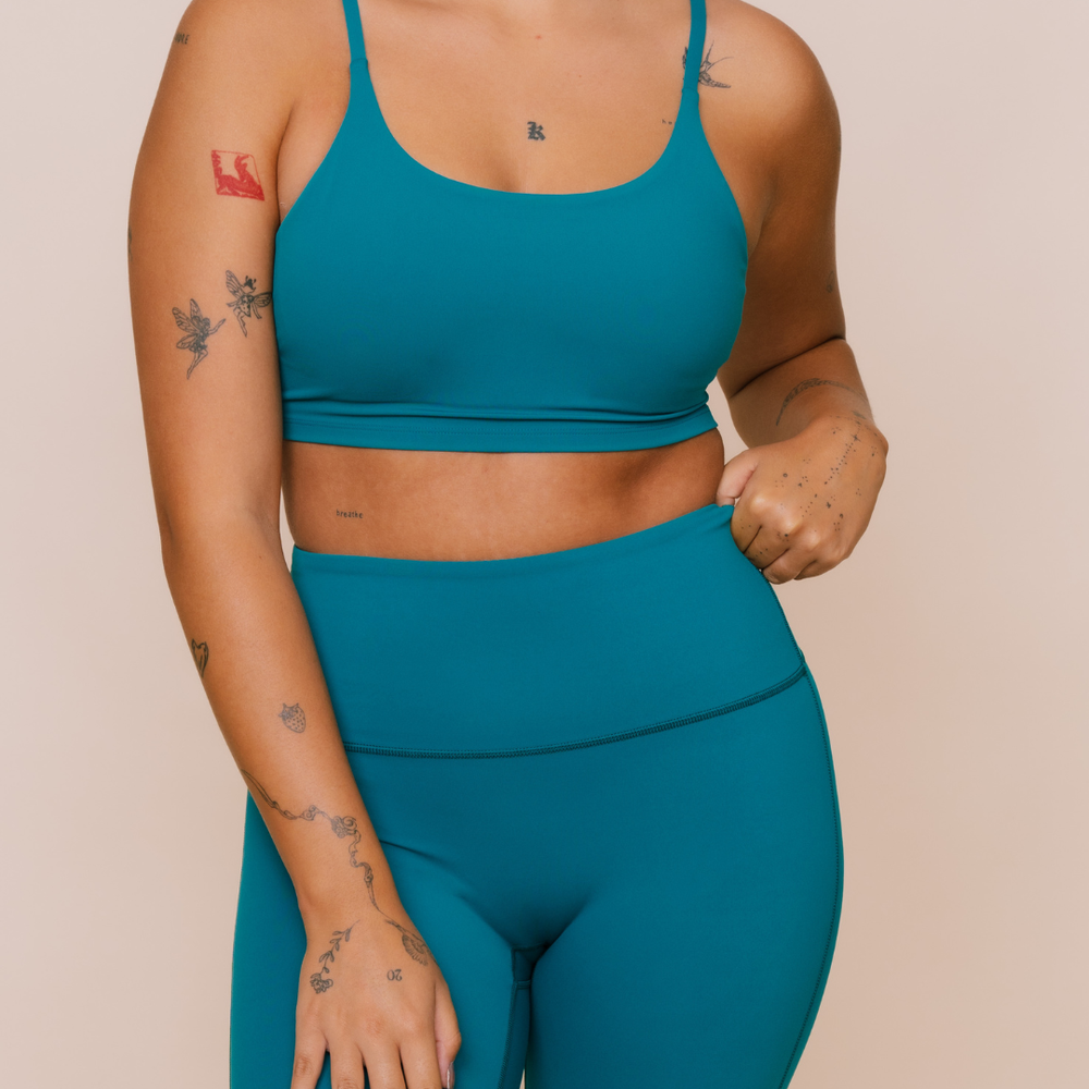 
                  
                    Eco-friendly teal green yoga outfit
                  
                