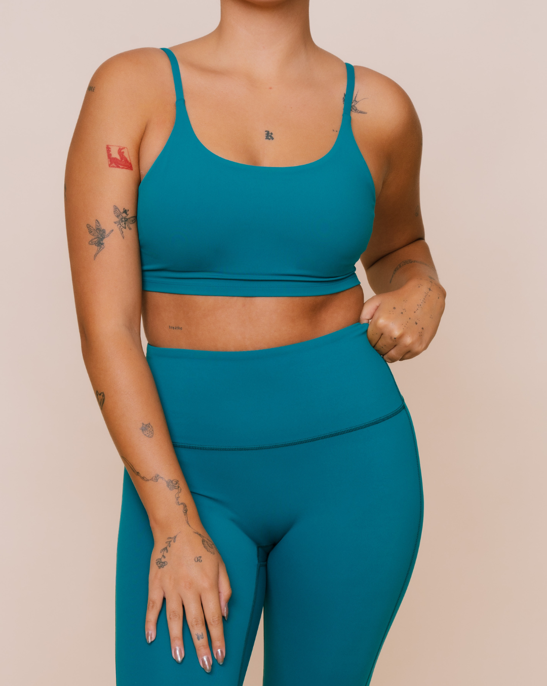 
                  
                    Eco-friendly teal green yoga outfit
                  
                
