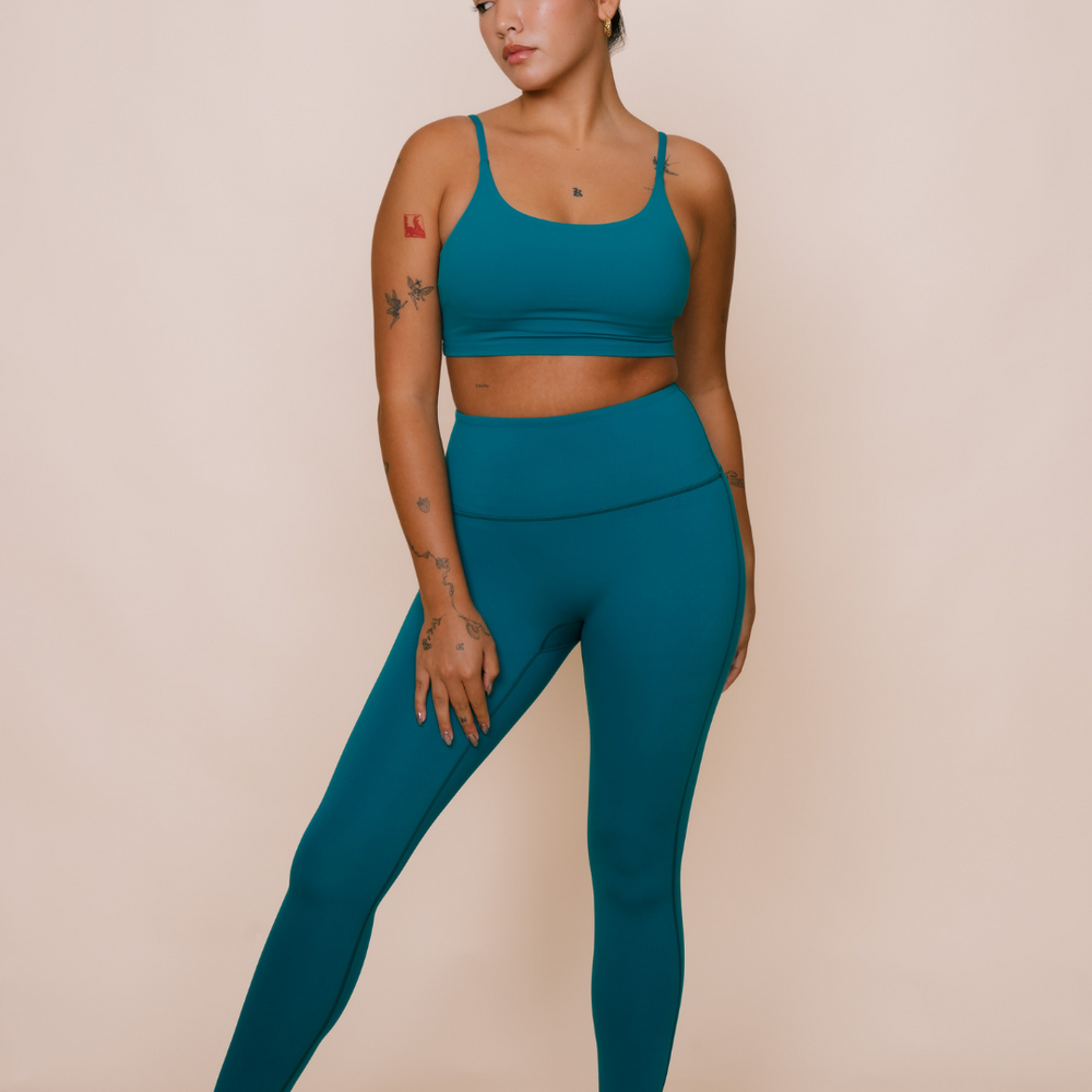 
                  
                    Teal green yoga set with quick-dry technology
                  
                