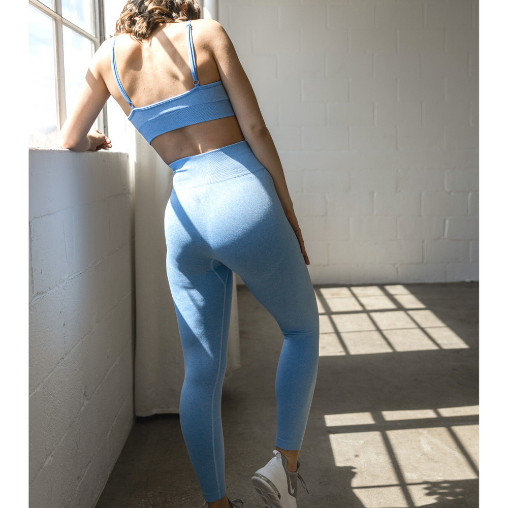 
                  
                    Form-fitting exercise wear in blue with high waistband
                  
                